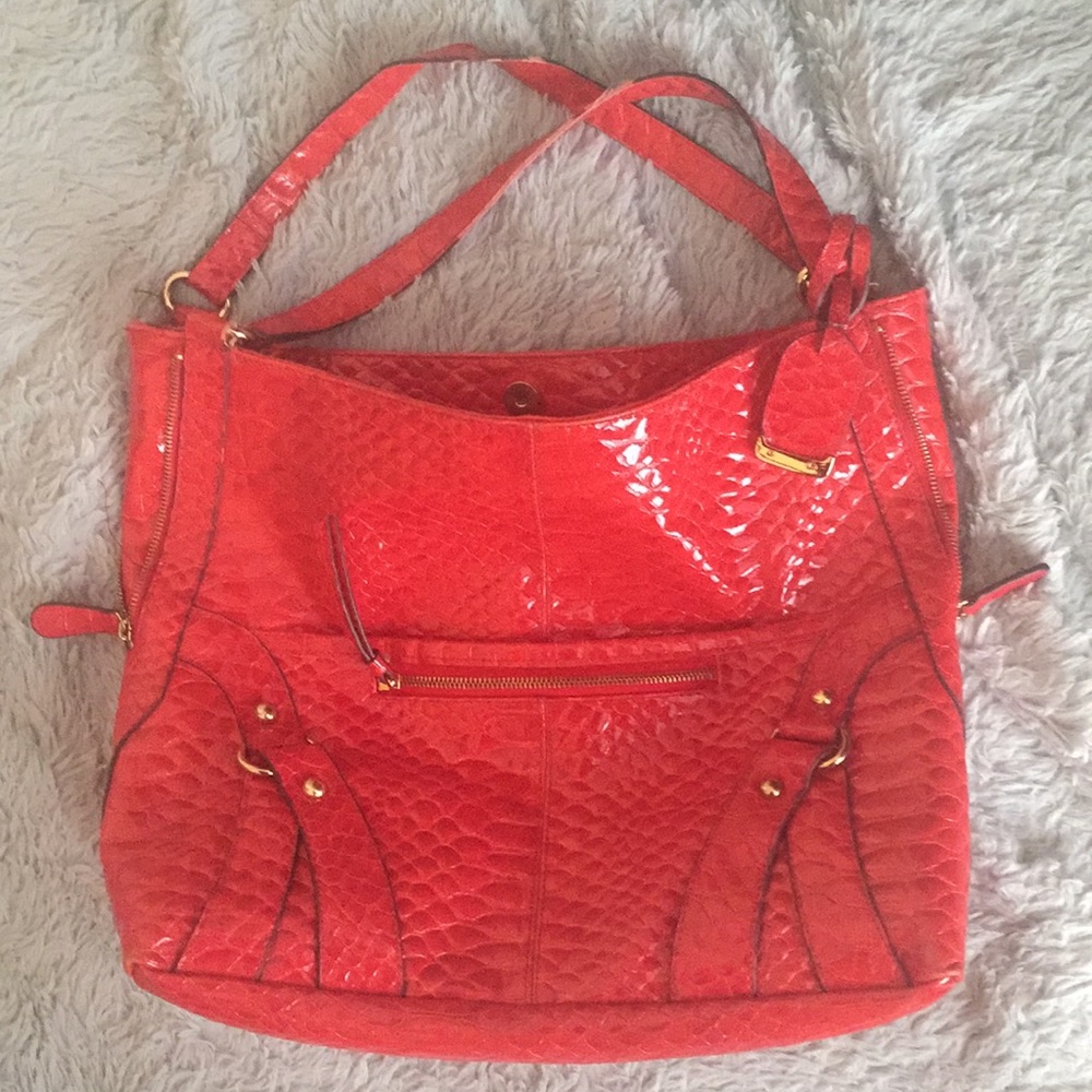bright orange snakeskin purse